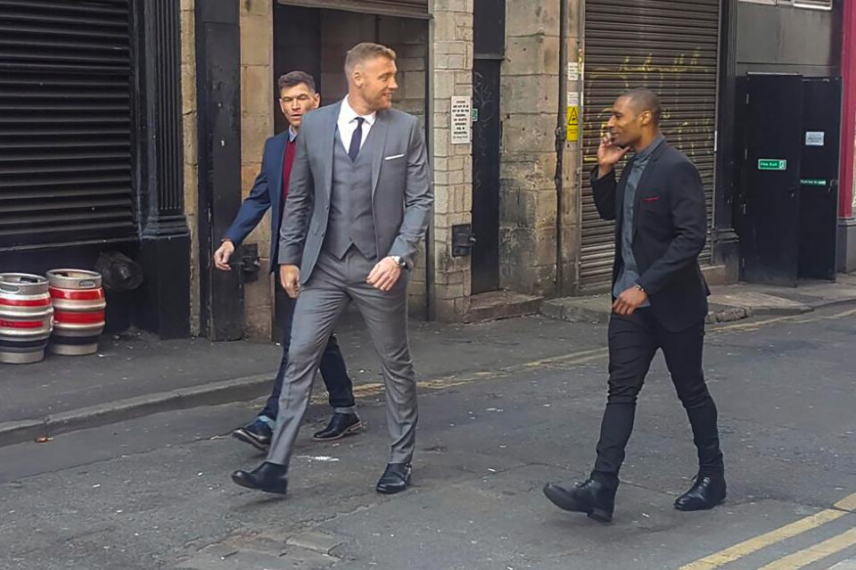  The ex-cricket ace looked smart in a grey three-piece suit