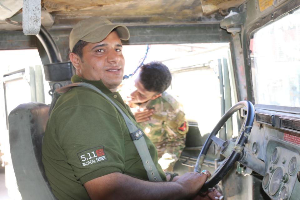  Ali, the chief sniper trainer of the unit and Haydar’s deputy, drives to the front line