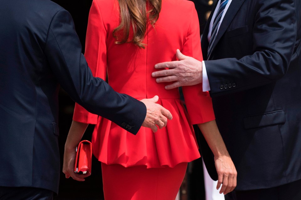 The two world leaders were seemingly fighting for Mrs Awada’s attention during the meeting