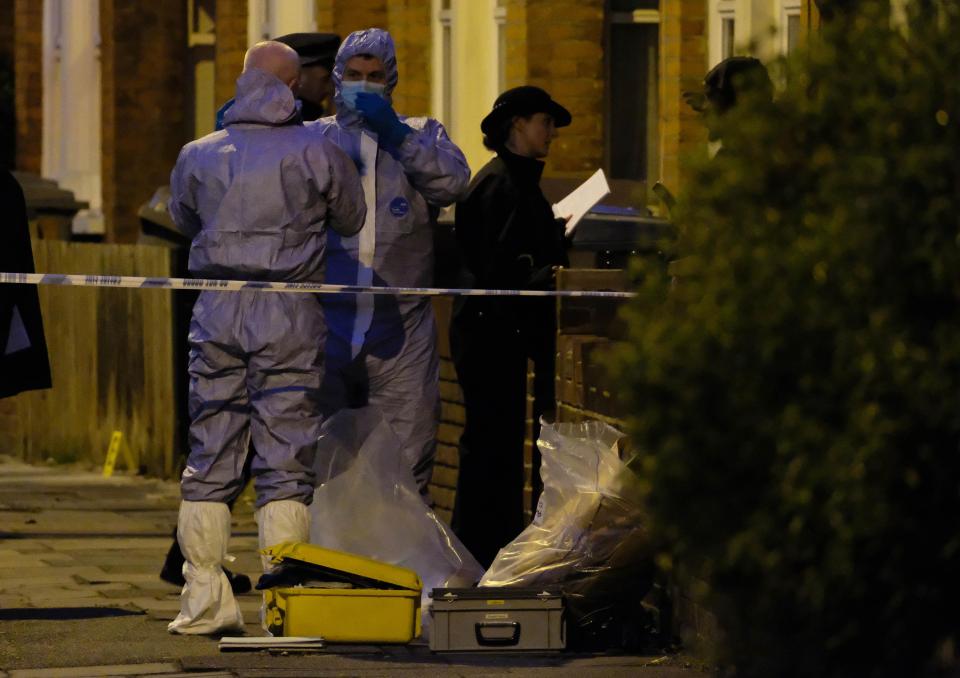  Forensic officers were pictured removing material from the scene of the raid