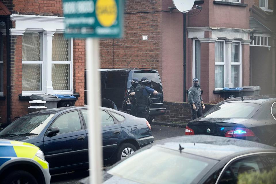  Armed cops wearing gas masks and bulletproof vests swooped on the property