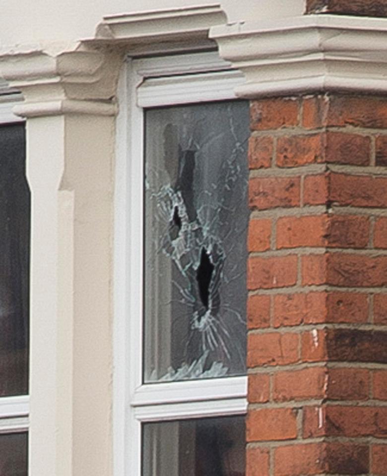  Bullet holes in the upstairs window of property which was raided in the early hours of this morning