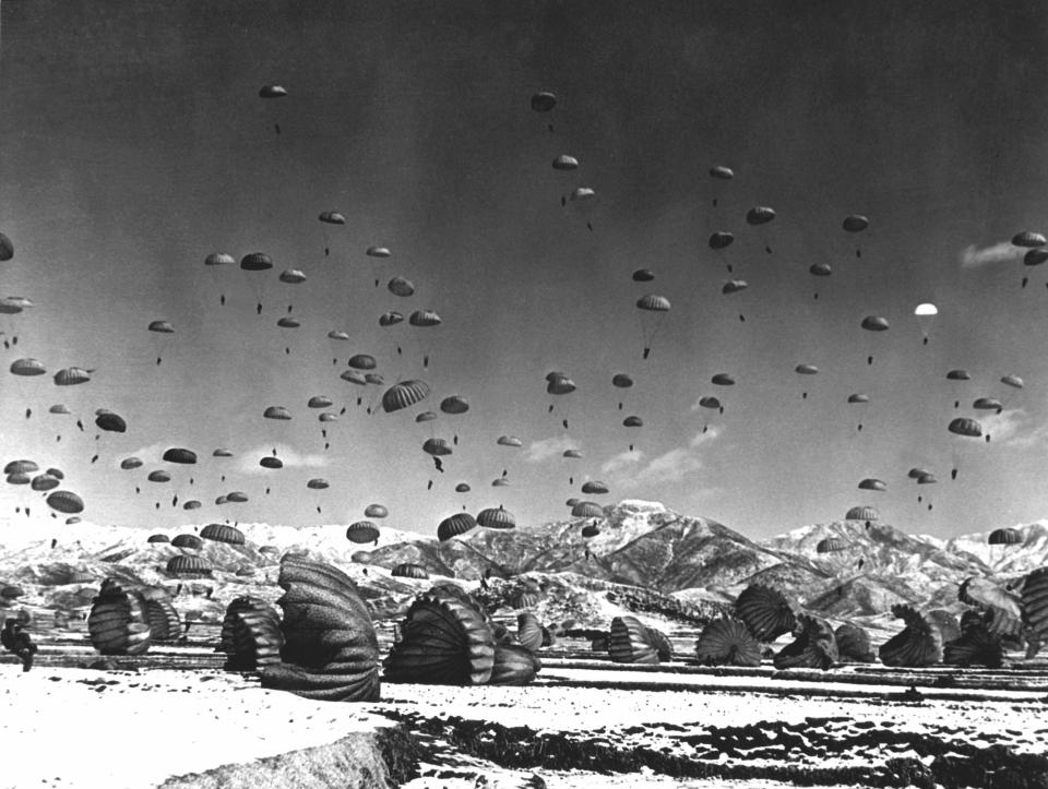  Men and equipment being parachuted to earth in an operation conducted by United Nations airborne units