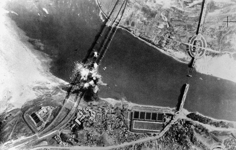  Air view of bombs dropped by US Air Force, exploding on three parallel railroad bridges across Han River, southwest of Seoul