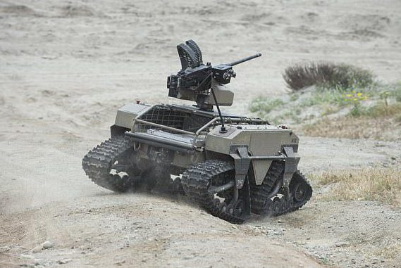  A MUTT robot, armed with a machine gun, undergoes testing in harsh territory in the US