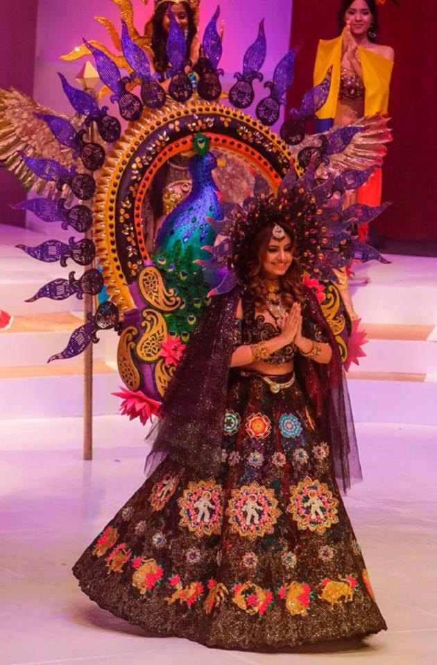  The London School of Fashion student won best national costume for her elaborate peacock shaped dress