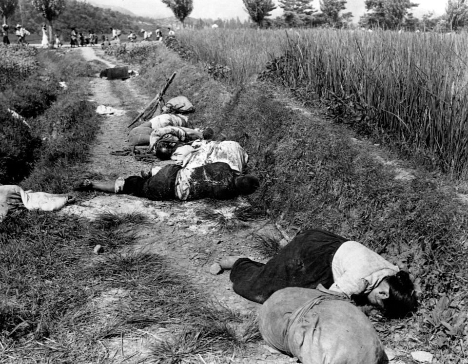  Korean civilians lie dead after an attempt to flee from the North Korean forces