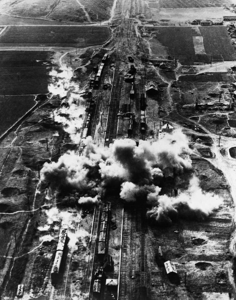  A railroad marshalling yard in North Korea is hit by a salvo of bombs dropped by B-26 'Invader'