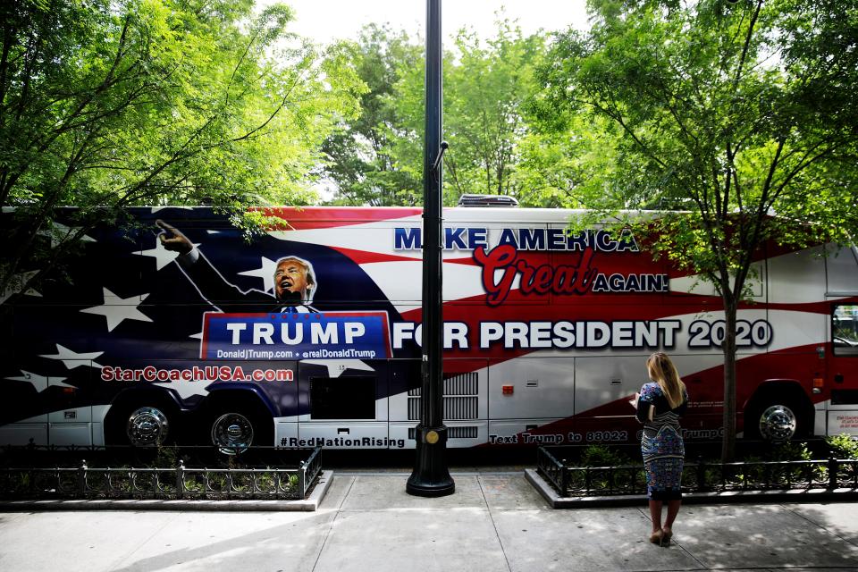 A bus promoting President Donald Trump's 2020 reelection passes by the National Rifle Association annual convention