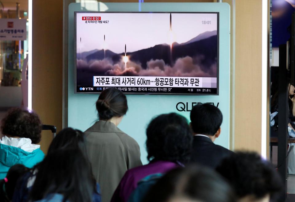  People watch a TV broadcasting of North Korea's failed missile launch at a railway station in Seoul