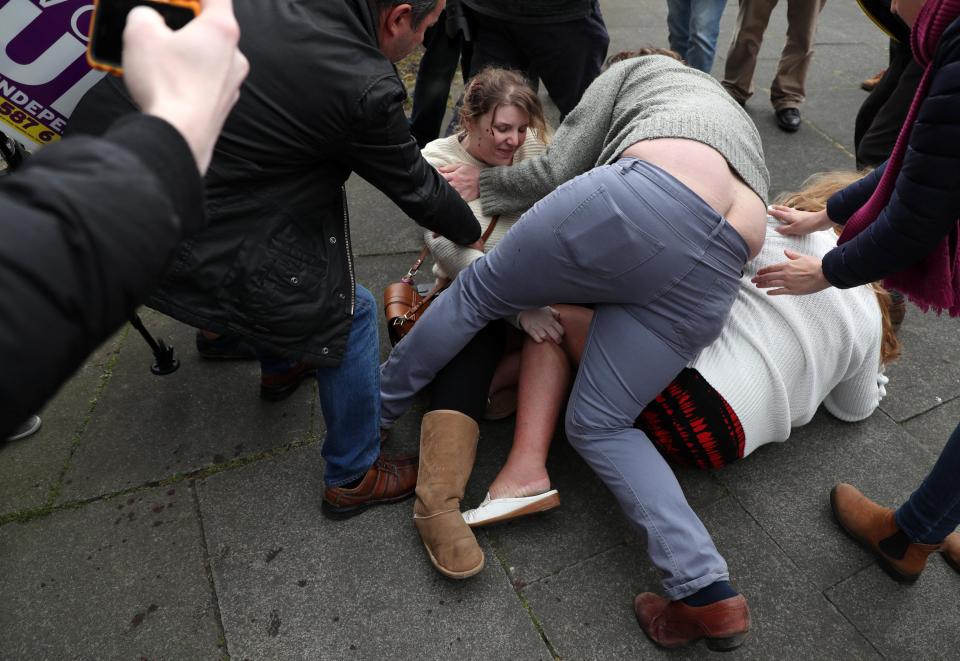  The pair ended up in a crumbled heap on the floor as several people desperately tried to break the scrap