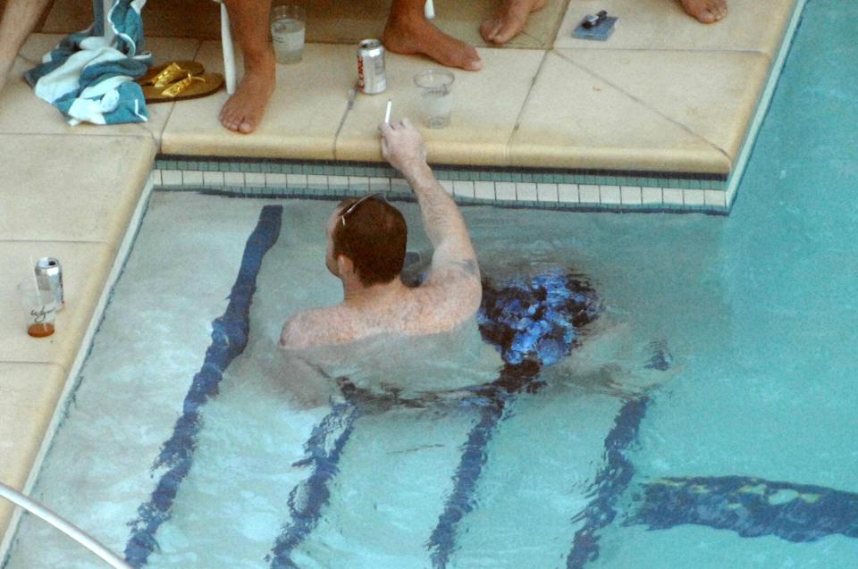  Boozy pool trip . . . Wayne Rooney pictured enjoying a drink on holiday with Coleen