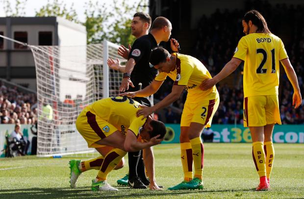 The former Oldham centre-half then fell the the ground after being struck on the head