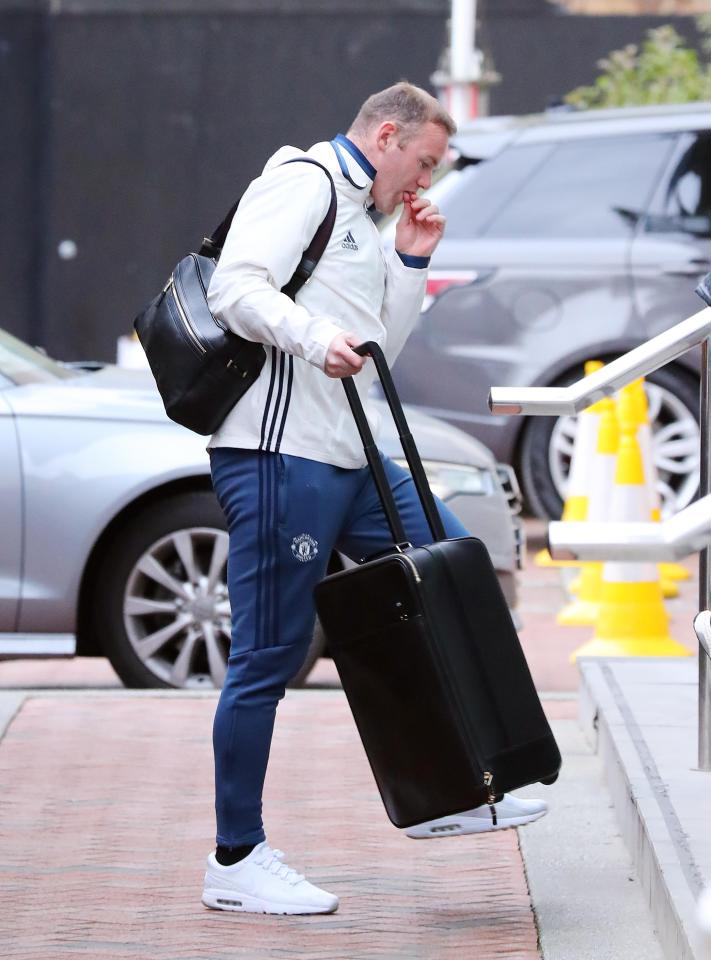  Thoughtful Red Devil . . . Wayne Rooney pictured with his suitcase ahead of Manchester United match