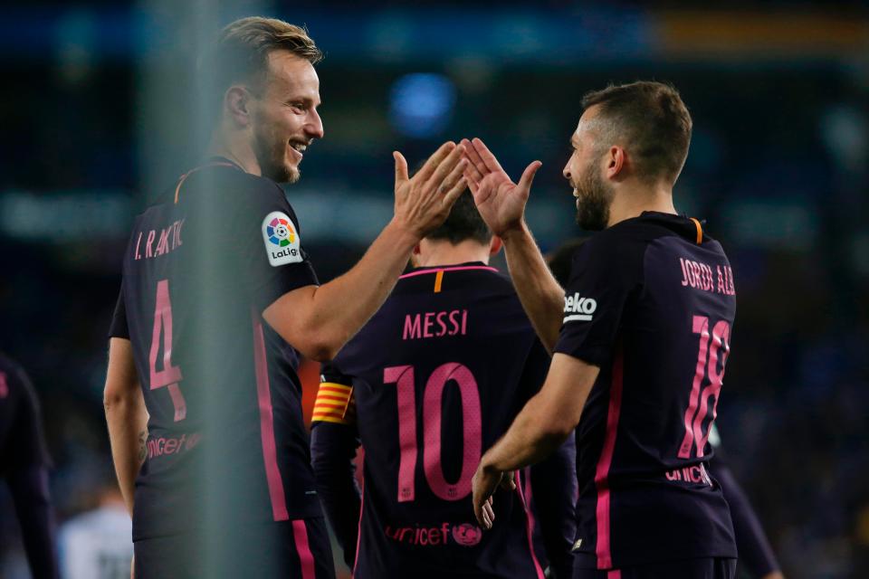  Jordi Alba and Ivan Rakitic celebrate after the former Sevilla man doubled Barcelona's lead