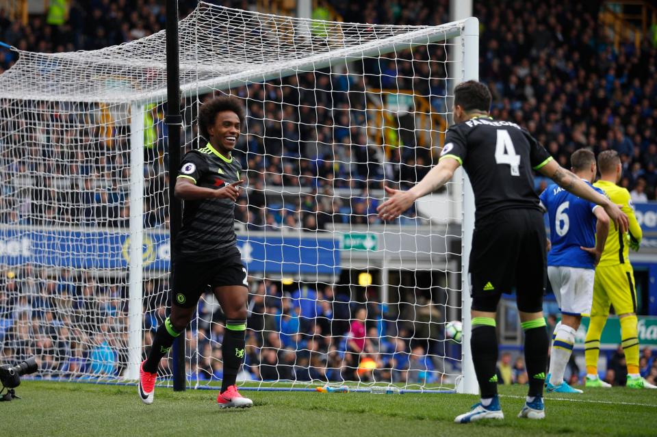  Willian celebrates scoring a third goal for his side a minute after coming on