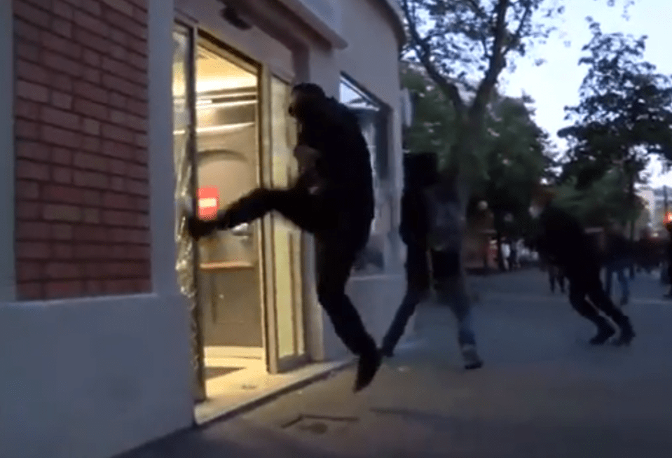  Shop windows were seen being kicked in by angry protesters and rioters in Paris this evening