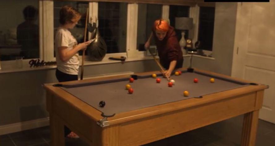  The kids play pool in the games room