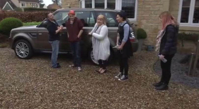  Angela and her kids check out the three luxury cars in the driveway