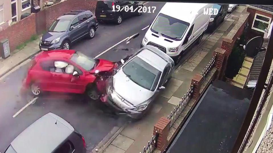  The car smashes into the front of a parked silver Peugeot