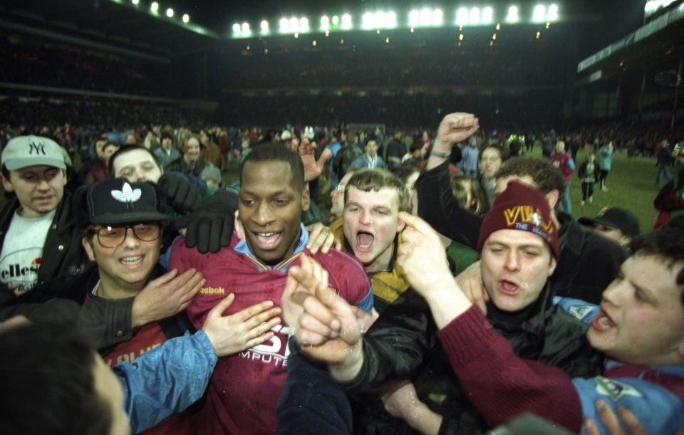  Villa's Ugo Ehiogu is mobbed by fans after a League Cup semi-final v Arsenal