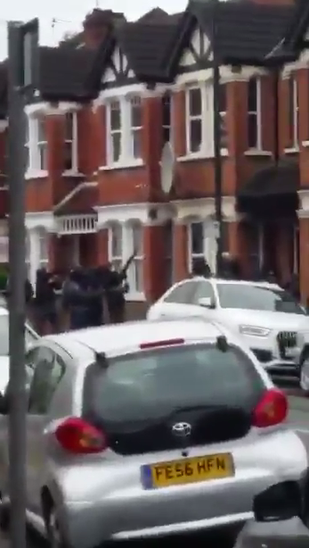  This dramatic footage shows the moment armed cops swarmed the house