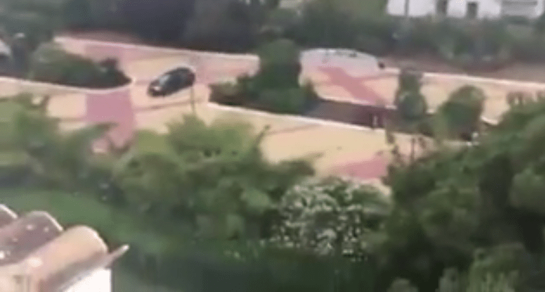 A car can be seen driving around the Marbella area with its tyres screeching