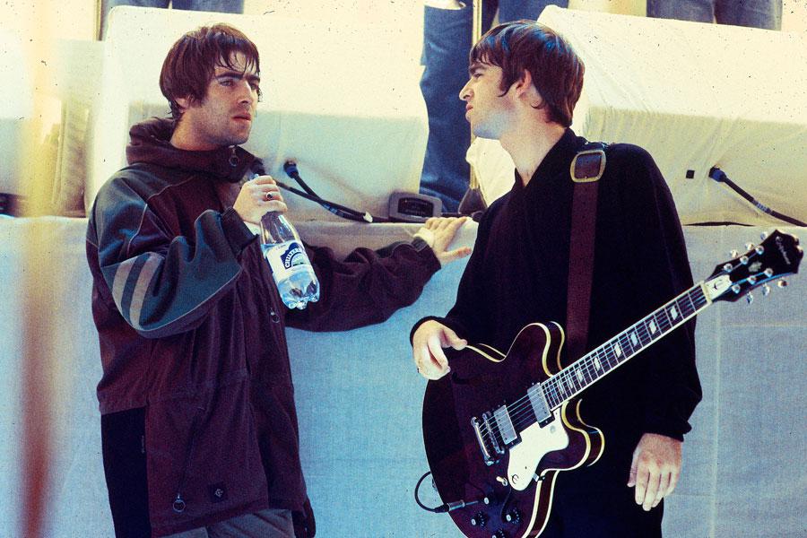  Liam with brother Noel during their Oasis days