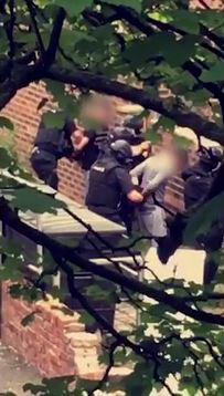  Armed police were tonight filmed handcuffing men in Rusholme, Manchester