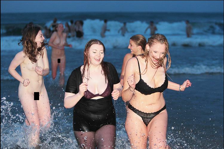  Some brave dippers bared all as they ran into the freezing water in the Scottish university town