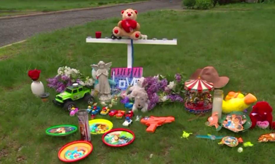  Items including cuddly toys, flowers and candles have been laid as a shrine to the 21-month-old boy