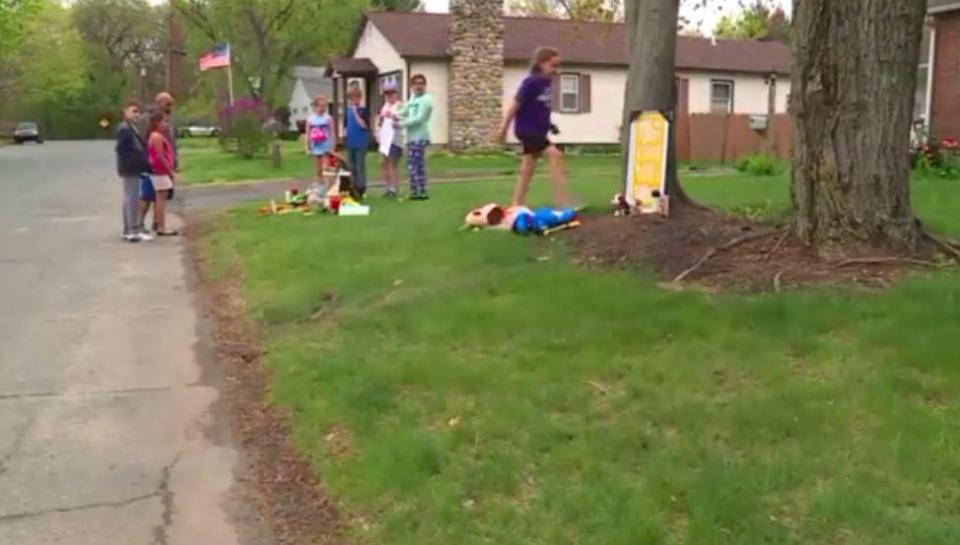  Children from the neighbourhood came to pay their respects as the close-knit community rallies round the grieving family