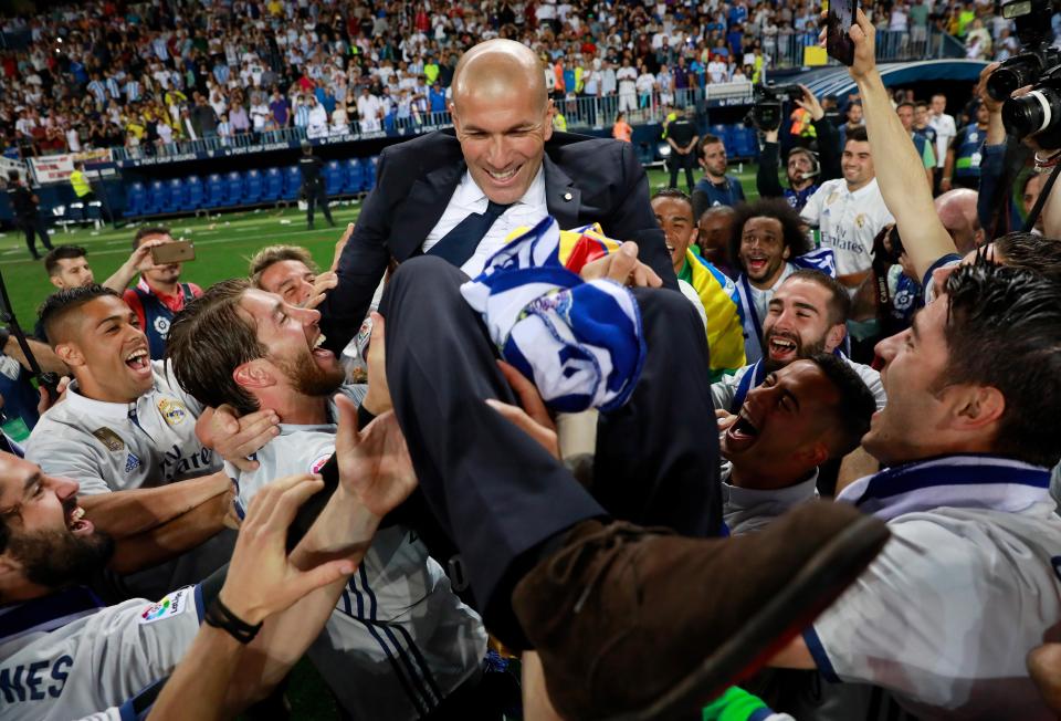 Zinedine Zidane is hoisted in the air after Real Madrid's La Liga win