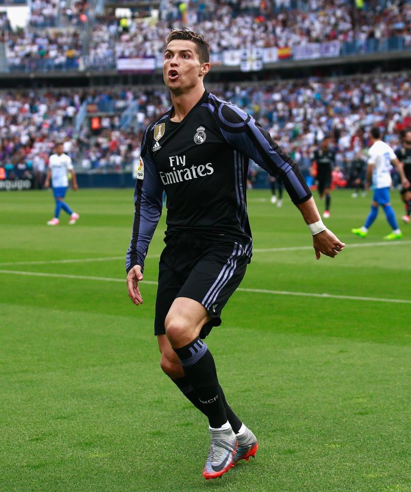 Cristiano Ronaldo celebrates his opening goal at Malaga