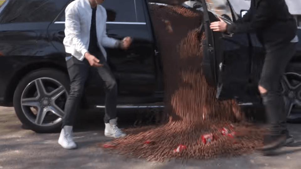  They pair opened the car door causing a waterfall of chocolate bites on to the pavement