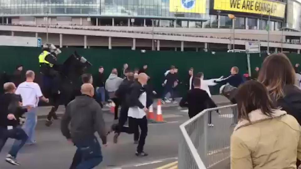  A huge brawl breaks out outside Wembley Stadium between rival Bradford and Millwall fans