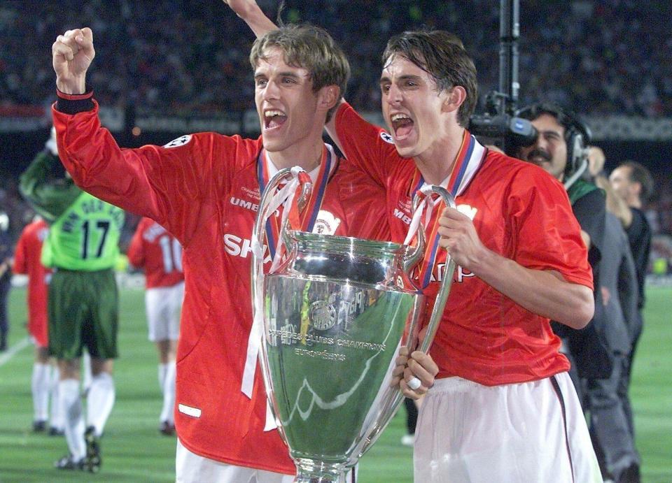  Gary and Phil Neville celebrate after Champions League success in 1999