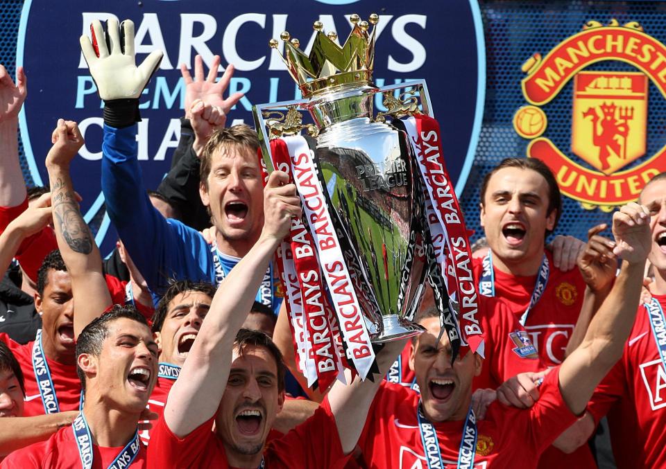  Gary Neville celebrates as Manchester United equal Liverpool's record of 18 titles