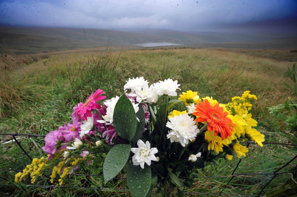 Flowers left on Saddleworth Moor in memory of Winnie Johnson