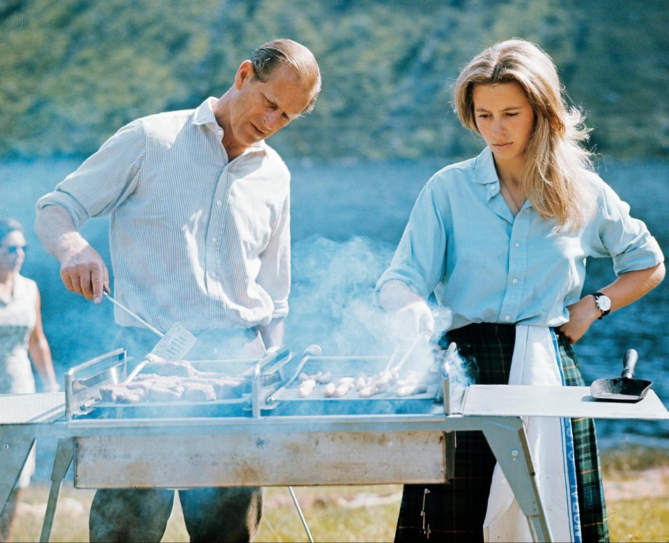  Prince Philip and Princess Anne preparing a barbecue on the Estate at Balmoral Castle in 1972