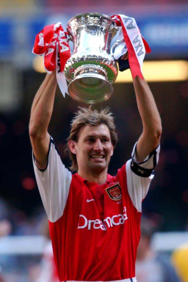  Tony Adams lifts the FA Cup for Arsenal a year after losing to Liverpool