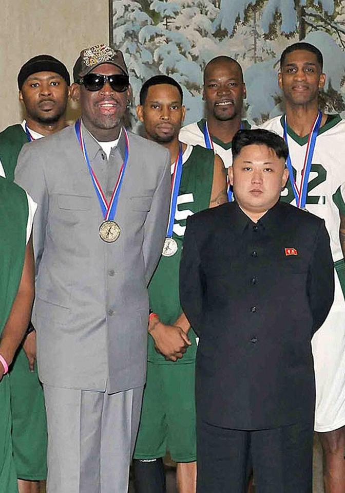  Kim with former basketball star Rodman and other former NBA players at Pyongyang Gymnasium in 2014