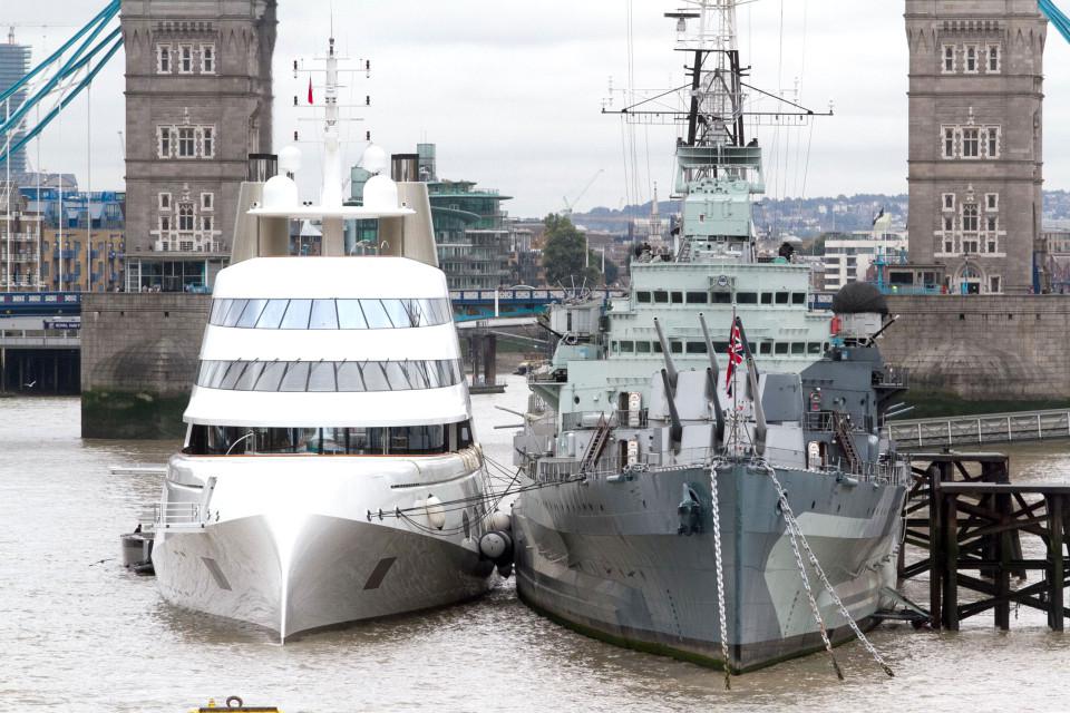  The two ships pictured side by side on the Thames as the superyacht moored next to the iconic warship HMS Belfast