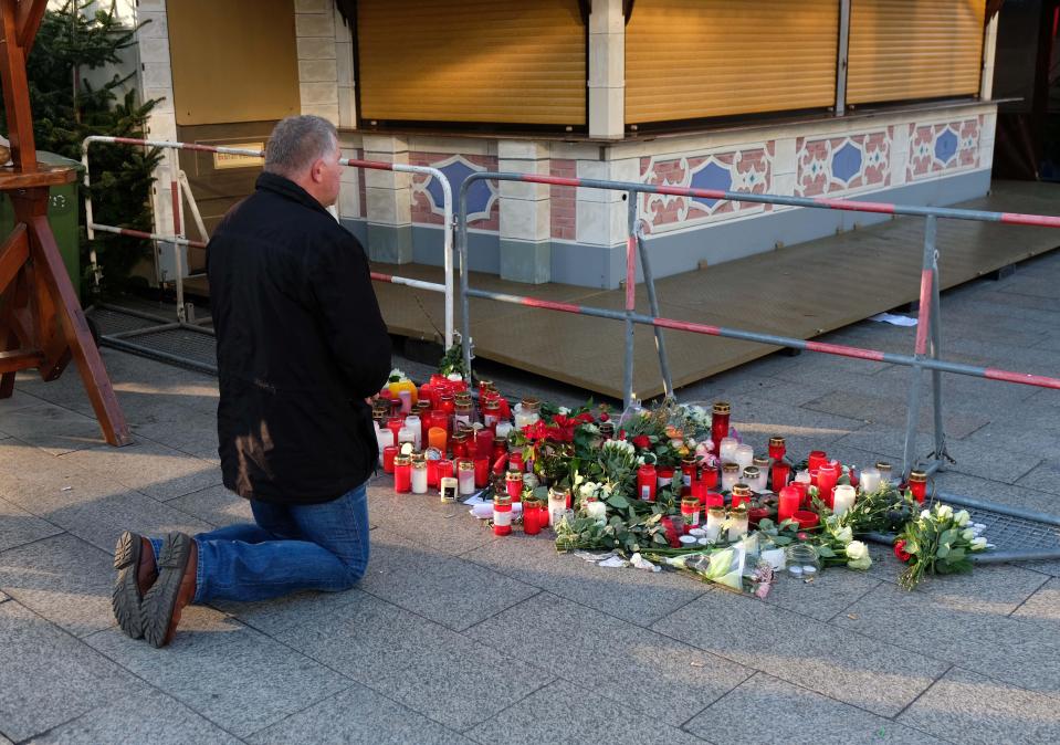  A man prays at the scene of the attack at the December Christmas market attack in Berlin