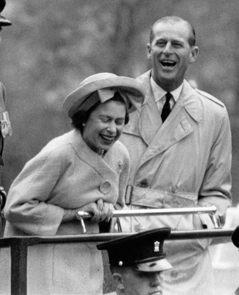  The Duke and Queen laugh at the expense of recruits performing for them at a military camp in Wales, in May 1963