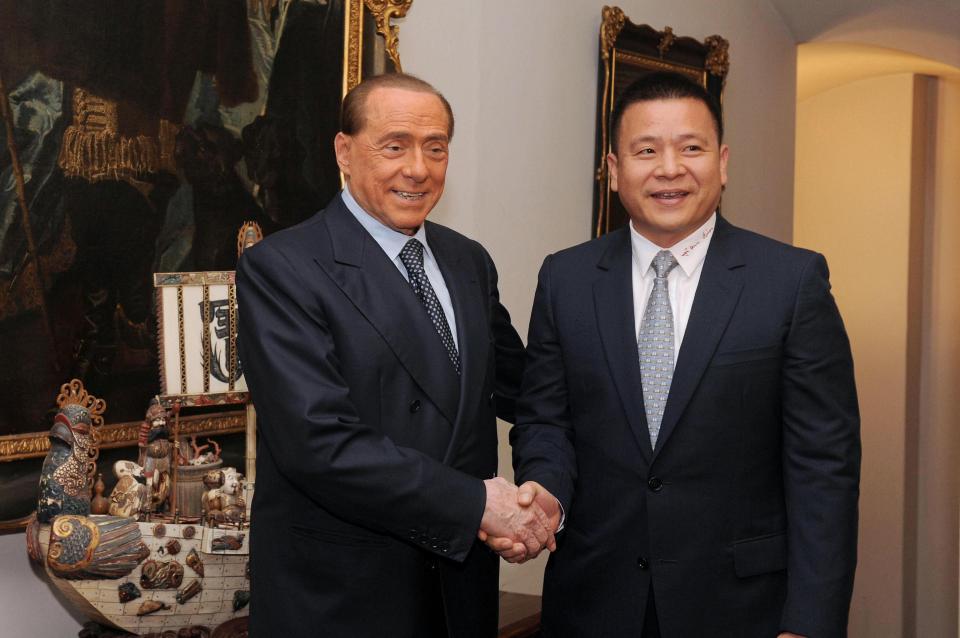  Former Milan owner Silvio Berlusconi with new owner Li Yonghong