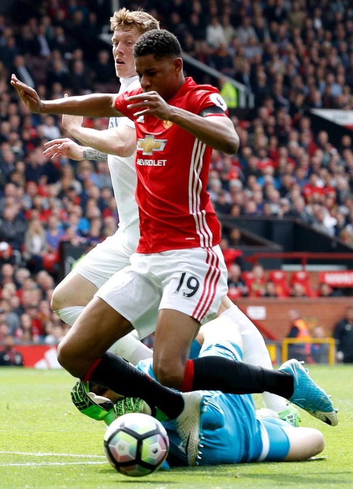  Rashford takes a tumble after going past Swansea keeper Lubasz Fabianski