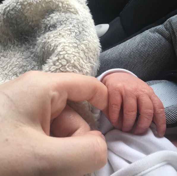  The former Towie star posted an adorable snapshot of herself holding her newborn's hand