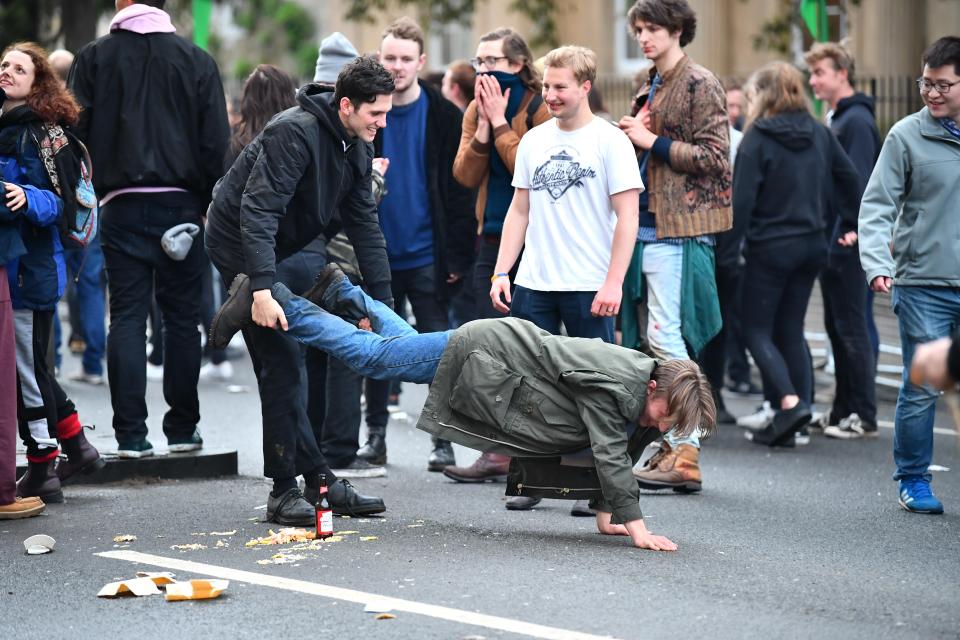  A rowdy group of friends continue the festivities in the streets of Oxford at dawn