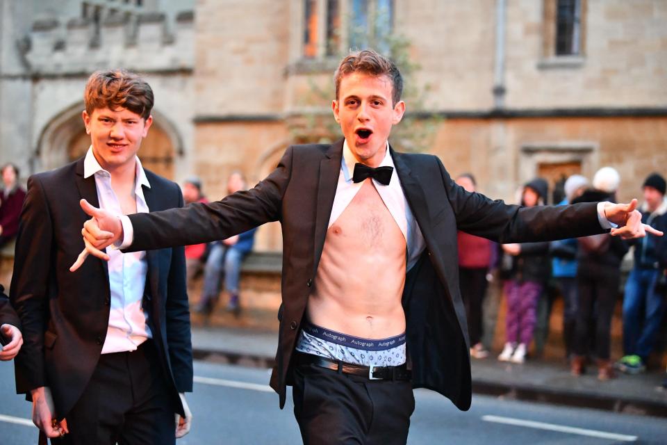  A dishevelled reveller looks in good spirits as the partying continues into the morning in Oxford